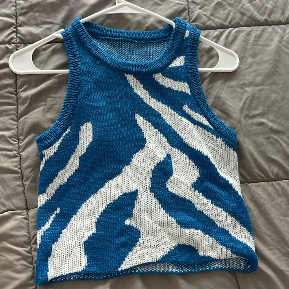 Womens knitted tank top color blue size medium , brand new never worn.
